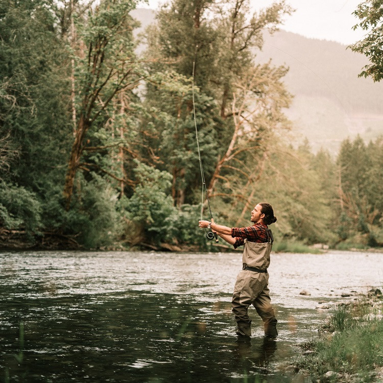 Breathable outdoor fabric fishing waders in a fishing scene