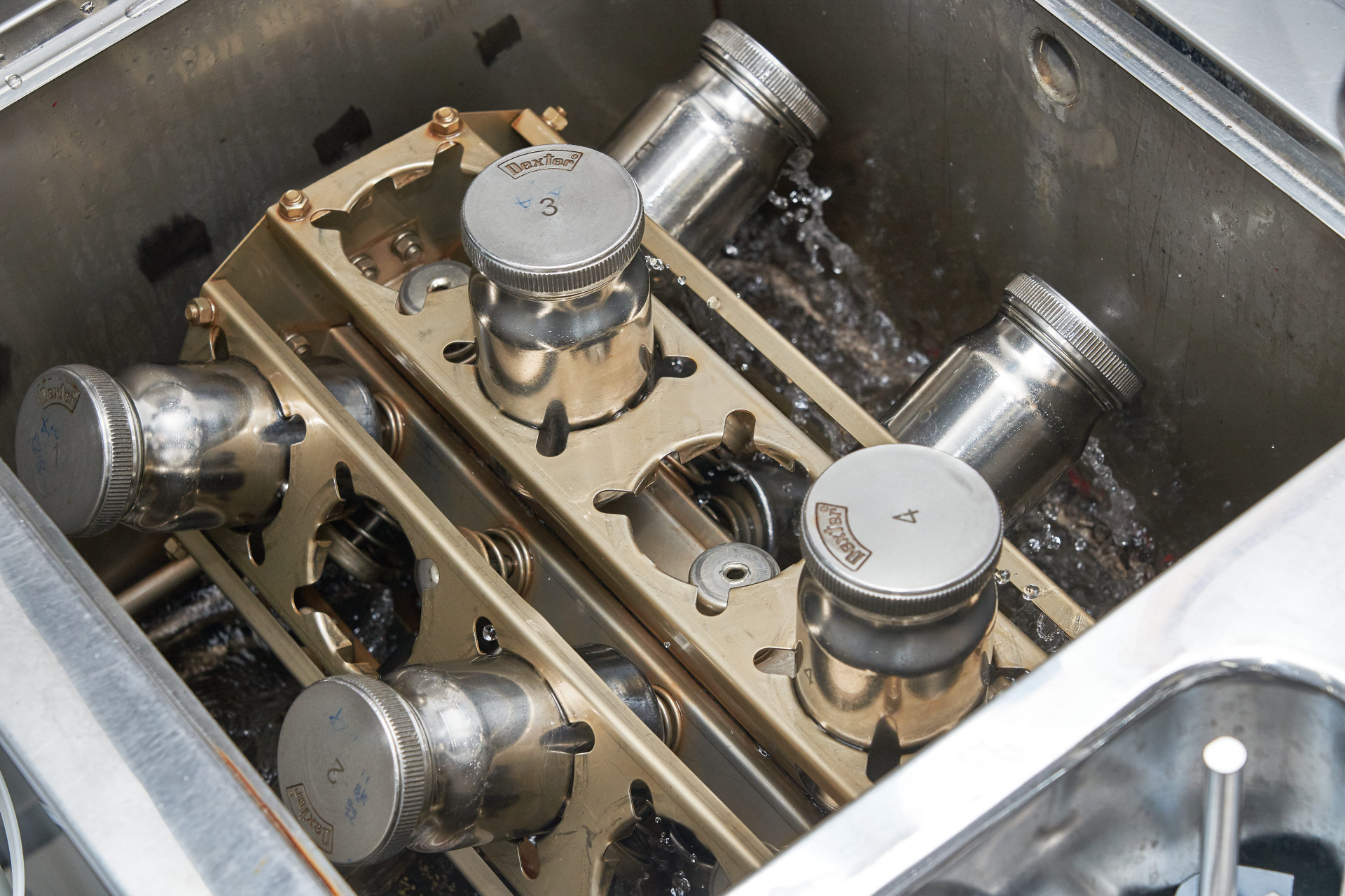 Colorfastness test machine with fabric cylinders running at 40&deg;C