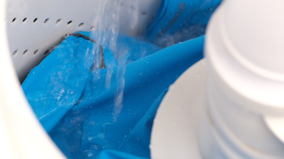 Outdoor fabric being washed and tested in a washing machine