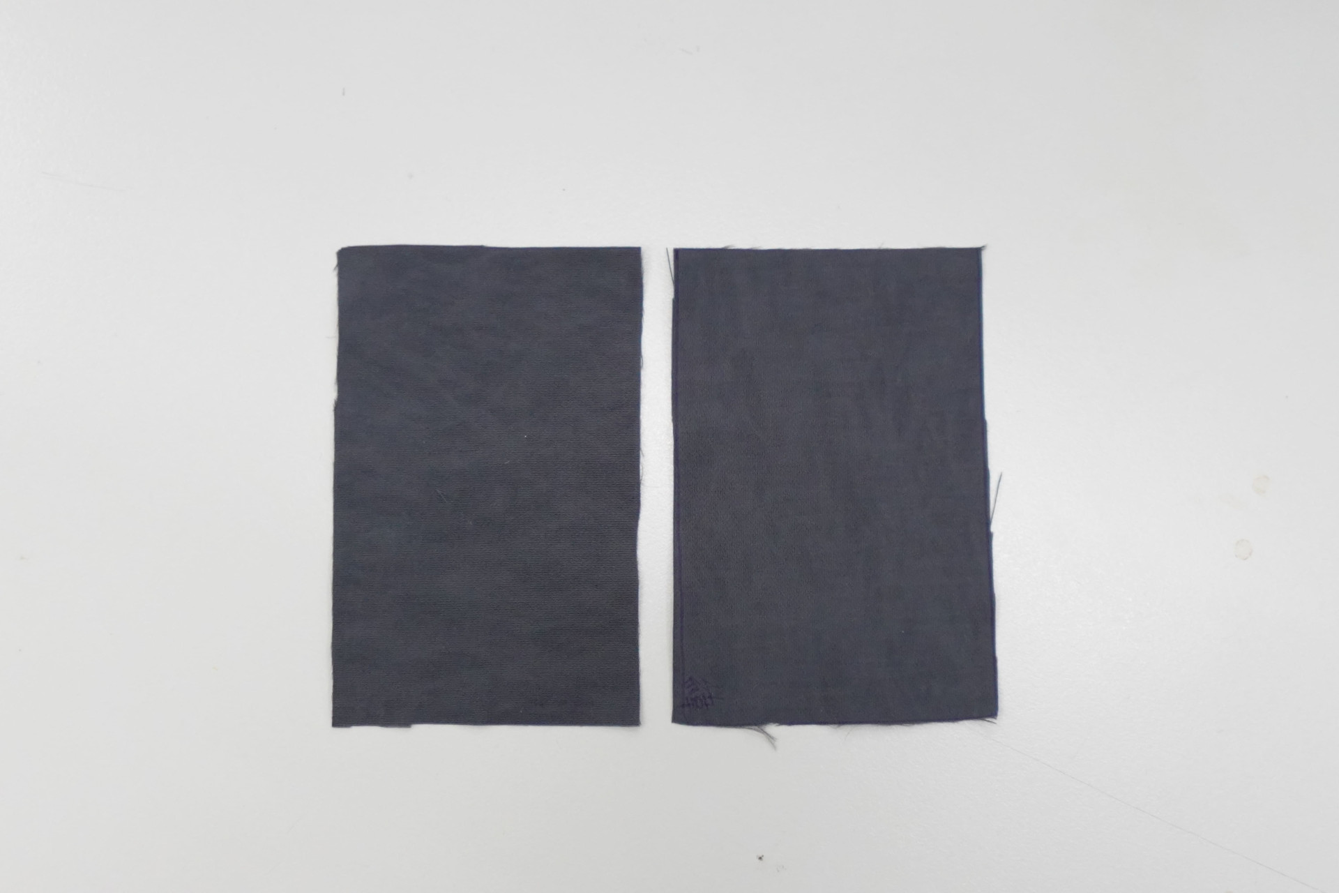 Fabric tear test samples before testing, shown intact side by side