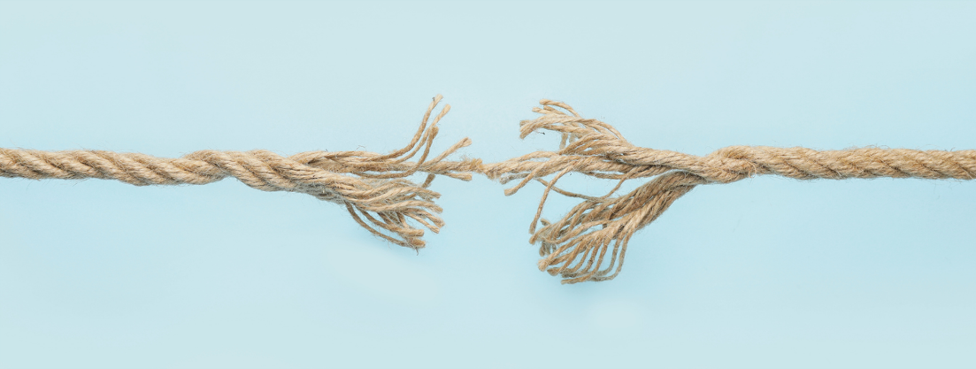 Frayed rope pulled apart illustrating tearing strength