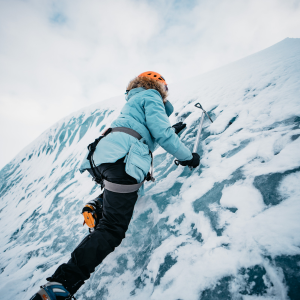 Person in mountaineering apparel made with weatherproof fabric