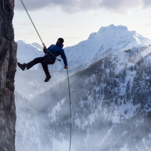 Climber wearing outdoor functional fabric on a mountain trail