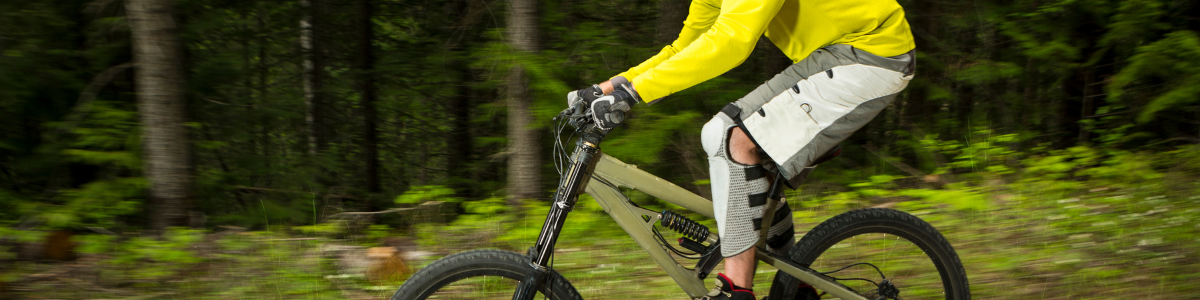 Cyclist wearing functional outdoor jacket for breathable and water-repellent performance